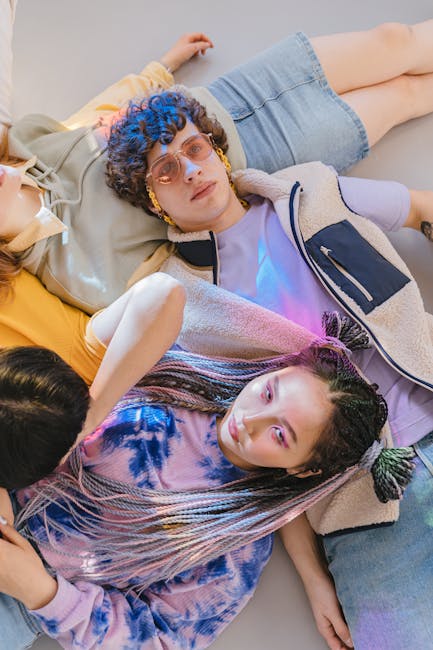 Group of diverse people relaxing and smiling in a comfortable setting.